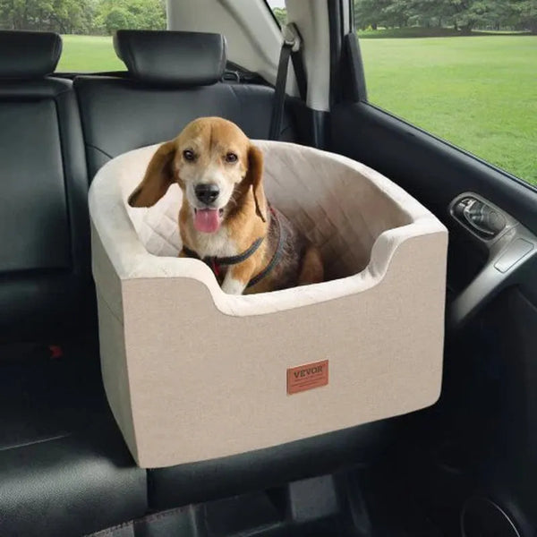 Basset hound dog sitting in tan dog car seat