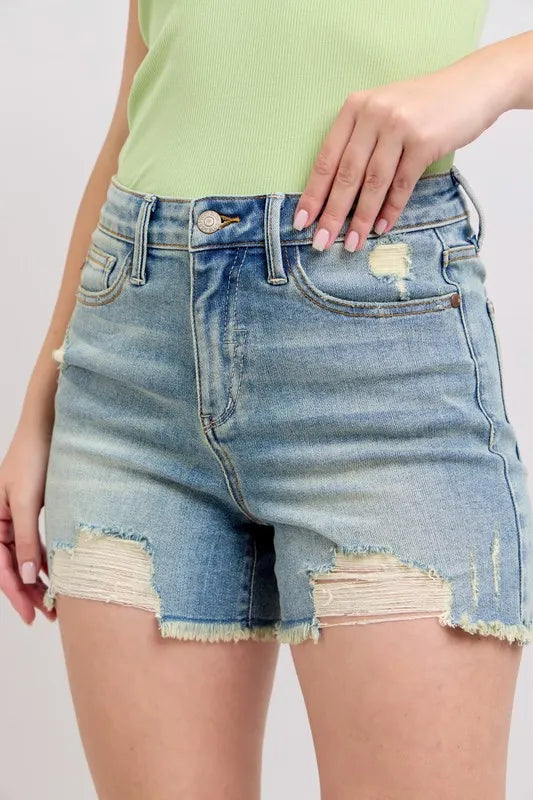 Model wearing denim jean shorts