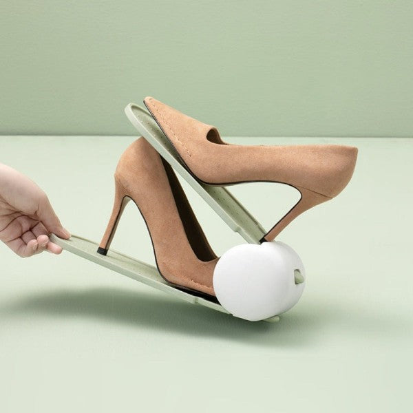 green shoe organizer holding beige women's heels