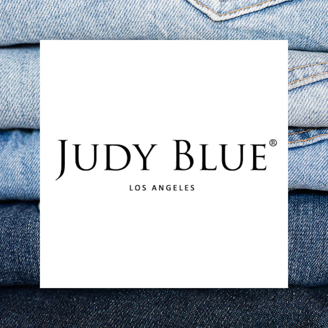 Judy Blue brand jeans logo with folded blue jeans in background