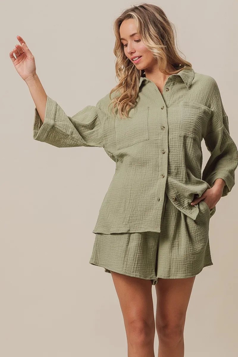 woman wearing olive green button down top and shorts outfit set
