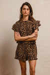 Woman wearing Leopard Print Waffle Texture Layered Ruffle Sleeve Top and Shorts Set-This leopard print set features a leopard print waffle texture top with layered ruffle sleeves, paired with matching shorts for a coordinated and stylish look. 