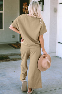 Textured, stretchy, and comfy. This two piece cropped pant with short sleeve top is a great travel set to stay comfortable in the car or plane. Available in a variety of colors and extended sizes.