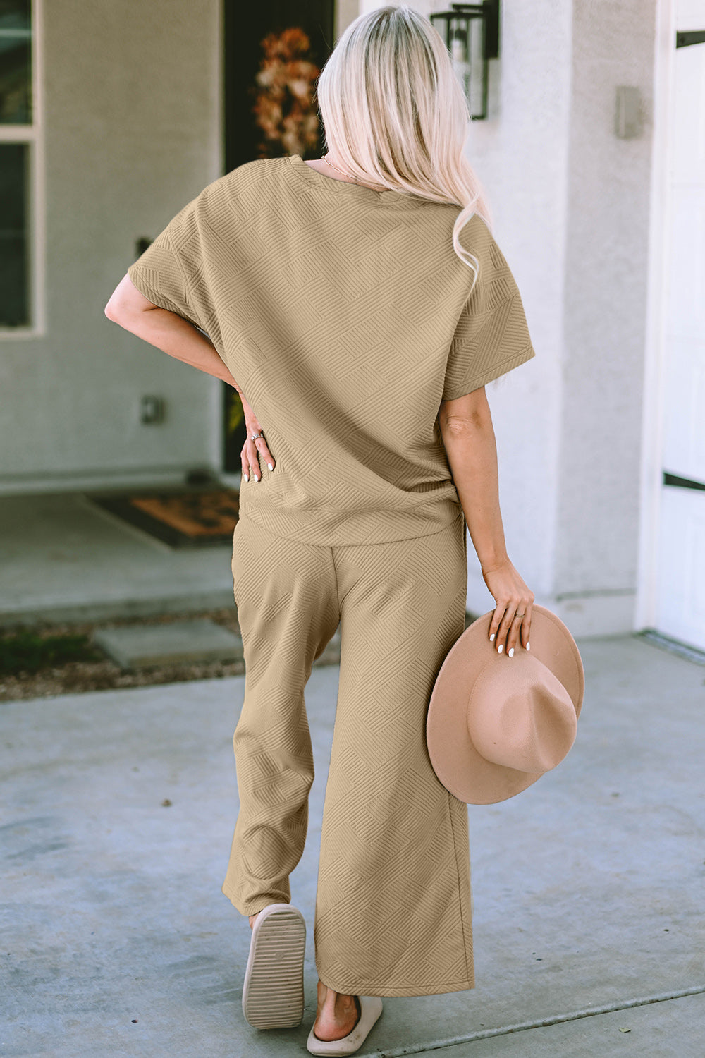 Textured, stretchy, and comfy. This two piece cropped pant with short sleeve top is a great travel set to stay comfortable in the car or plane. Available in a variety of colors and extended sizes.