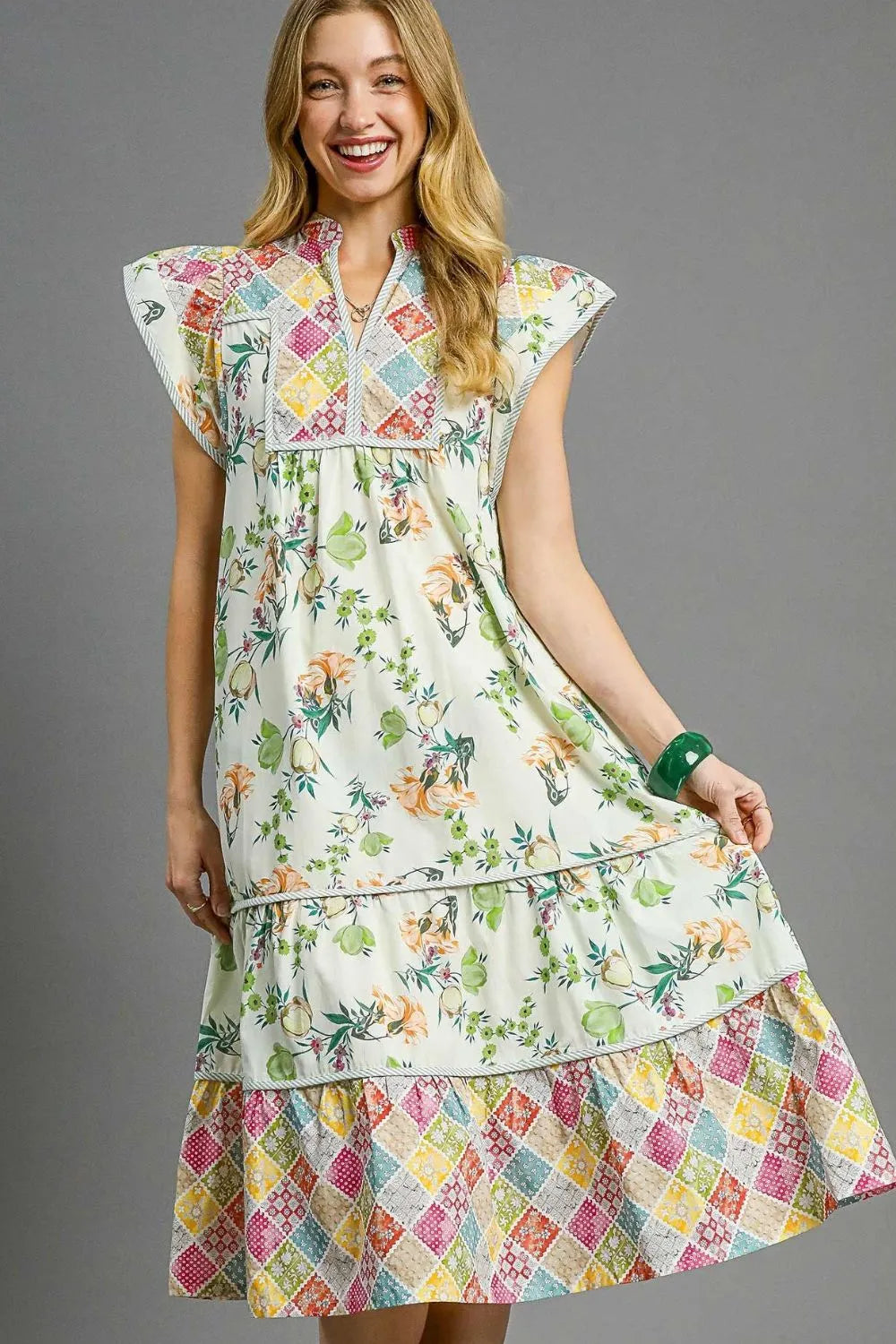 Woman wearing Patchwork Garden Midi Dress-Boho-inspired midi dress features a delightful floral print on flowing fabric that moves beautifully. perfect for warm weather, casual daywear to vacation styling. 