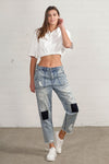 Shop Slouch Raw Hem Vintage Patched Cropped Jeans-Laid-back and vintage-inspired, the Slouch Raw Hem Patched Cropped Jeans feature patched knees, a raw hem, and mid-rise fit in 100% cotton light wash denim.-Reef Love Boho-Chic Boutique