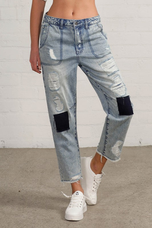 Shop Slouch Raw Hem Vintage Patched Cropped Jeans-Laid-back and vintage-inspired, the Slouch Raw Hem Patched Cropped Jeans feature patched knees, a raw hem, and mid-rise fit in 100% cotton light wash denim.-Reef Love Boho-Chic Boutique