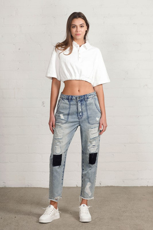 Shop Slouch Raw Hem Vintage Patched Cropped Jeans-Laid-back and vintage-inspired, the Slouch Raw Hem Patched Cropped Jeans feature patched knees, a raw hem, and mid-rise fit in 100% cotton light wash denim.-Reef Love Boho-Chic Boutique