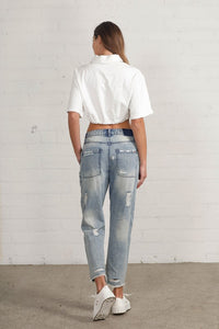 Shop Slouch Raw Hem Vintage Patched Cropped Jeans-Laid-back and vintage-inspired, the Slouch Raw Hem Patched Cropped Jeans feature patched knees, a raw hem, and mid-rise fit in 100% cotton light wash denim.-Reef Love Boho-Chic Boutique