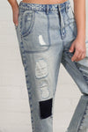 Shop Slouch Raw Hem Vintage Patched Cropped Jeans-Laid-back and vintage-inspired, the Slouch Raw Hem Patched Cropped Jeans feature patched knees, a raw hem, and mid-rise fit in 100% cotton light wash denim.-Reef Love Boho-Chic Boutique
