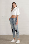 Shop Slouch Raw Hem Vintage Patched Cropped Jeans-Laid-back and vintage-inspired, the Slouch Raw Hem Patched Cropped Jeans feature patched knees, a raw hem, and mid-rise fit in 100% cotton light wash denim.-Reef Love Boho-Chic Boutique