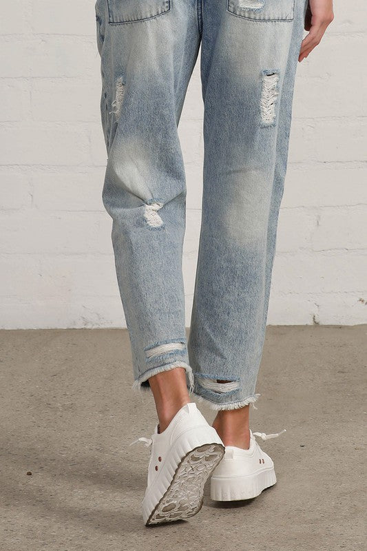 Shop Slouch Raw Hem Vintage Patched Cropped Jeans-Laid-back and vintage-inspired, the Slouch Raw Hem Patched Cropped Jeans feature patched knees, a raw hem, and mid-rise fit in 100% cotton light wash denim.-Reef Love Boho-Chic Boutique