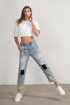 Shop Slouch Raw Hem Vintage Patched Cropped Jeans-Laid-back and vintage-inspired, the Slouch Raw Hem Patched Cropped Jeans feature patched knees, a raw hem, and mid-rise fit in 100% cotton light wash denim.-Reef Love Boho-Chic Boutique