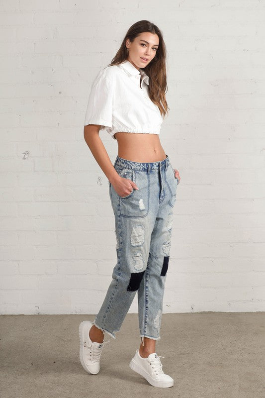 Shop Slouch Raw Hem Vintage Patched Cropped Jeans-Laid-back and vintage-inspired, the Slouch Raw Hem Patched Cropped Jeans feature patched knees, a raw hem, and mid-rise fit in 100% cotton light wash denim.-Reef Love Boho-Chic Boutique