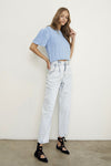 Woman wearing Balloon Slouch Jeans-Balloon Slouch Jeans in light wash denim with high-rise fit, pleated front, and relaxed ankle-length silhouette. 100% cotton for that true vintage feel.