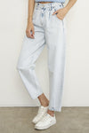 Woman wearing Balloon Slouch Jeans-Balloon Slouch Jeans in light wash denim with high-rise fit, pleated front, and relaxed ankle-length silhouette. 100% cotton for that true vintage feel.