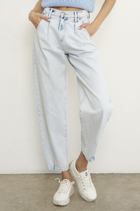Woman wearing Balloon Slouch Jeans-Balloon Slouch Jeans in light wash denim with high-rise fit, pleated front, and relaxed ankle-length silhouette. 100% cotton for that true vintage feel.