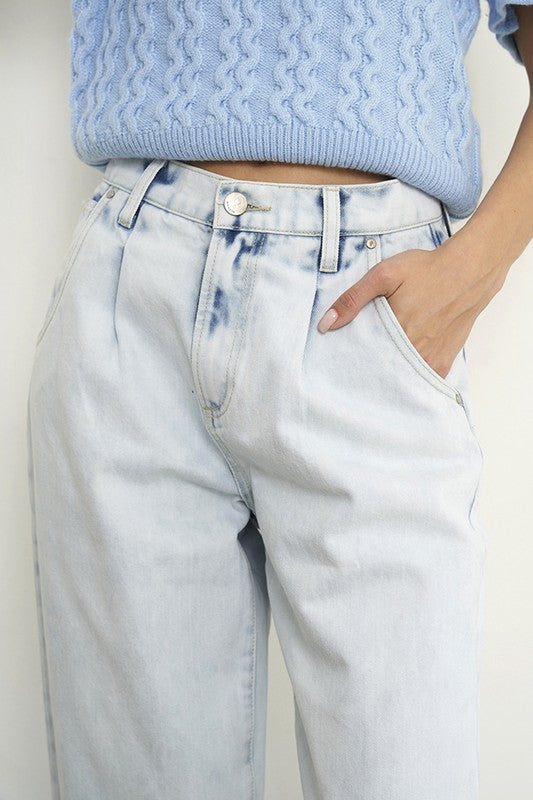 Woman wearing Balloon Slouch Jeans-Balloon Slouch Jeans in light wash denim with high-rise fit, pleated front, and relaxed ankle-length silhouette. 100% cotton for that true vintage feel.
