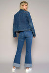 Woman wearing High Rise Cuff Cropped Bootcut Jeans-Flattering women's high-rise cuffed crop boot jeans in dark wash denim. Stretchy, cropped, and stylish—perfect for casual-chic looks.