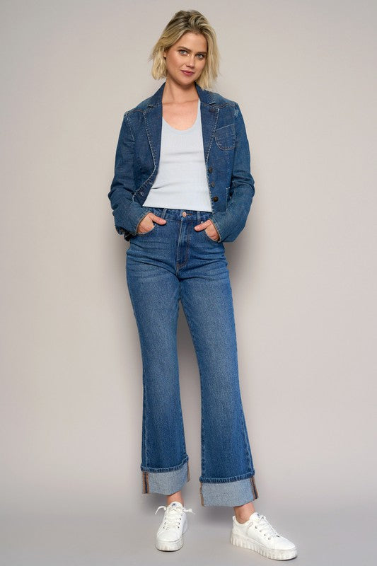 Woman wearing High Rise Cuff Cropped Bootcut Jeans-Flattering women's high-rise cuffed crop boot jeans in dark wash denim. Stretchy, cropped, and stylish—perfect for casual-chic looks.