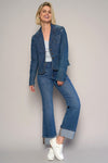 Woman wearing High Rise Cuff Cropped Bootcut Jeans-Flattering women's high-rise cuffed crop boot jeans in dark wash denim. Stretchy, cropped, and stylish—perfect for casual-chic looks.