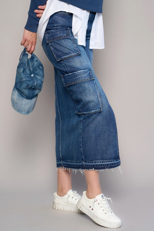 Shop Cargo Pocket Midi Denim Skirt-This Cargo Pocket Midi Denim Skirt features 8 functional pockets, a front slit, and a dark wash finish in 100% cotton denim. A must-have for everyday style.-Reef Love Boho-Chic Boutique
