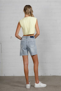 Shop High Rise Mid-Length Bermuda Shorts-These High Rise Bermuda Shorts in medium wash denim feature a raw hem, flattering mid-thigh length, and 100% cotton construction—perfect for warm-weather style.-Reef Love Boho-Chic Boutique