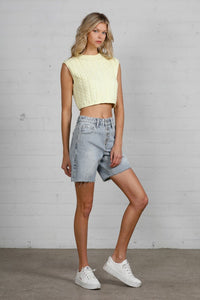 Shop High Rise Mid-Length Bermuda Shorts-These High Rise Bermuda Shorts in medium wash denim feature a raw hem, flattering mid-thigh length, and 100% cotton construction—perfect for warm-weather style.-Reef Love Boho-Chic Boutique