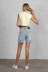 Shop High Rise Mid-Length Bermuda Shorts-These High Rise Bermuda Shorts in medium wash denim feature a raw hem, flattering mid-thigh length, and 100% cotton construction—perfect for warm-weather style.-Reef Love Boho-Chic Boutique
