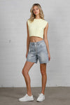 Shop High Rise Mid-Length Bermuda Shorts-These High Rise Bermuda Shorts in medium wash denim feature a raw hem, flattering mid-thigh length, and 100% cotton construction—perfect for warm-weather style.-Reef Love Boho-Chic Boutique