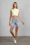 Shop High Rise Mid-Length Bermuda Shorts-These High Rise Bermuda Shorts in medium wash denim feature a raw hem, flattering mid-thigh length, and 100% cotton construction—perfect for warm-weather style.-Reef Love Boho-Chic Boutique