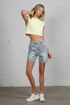 Shop High Rise Mid-Length Bermuda Shorts-These High Rise Bermuda Shorts in medium wash denim feature a raw hem, flattering mid-thigh length, and 100% cotton construction—perfect for warm-weather style.-Reef Love Boho-Chic Boutique
