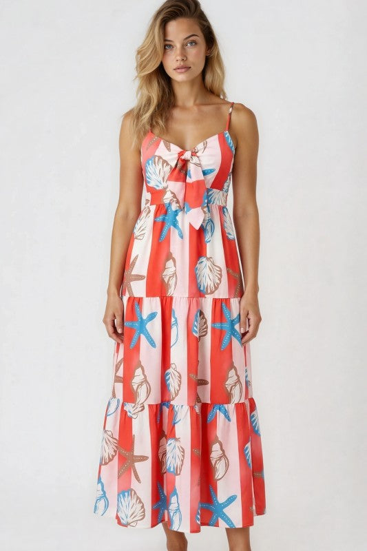 Seaside Maxi Dress: Sweetheart neckline, front-tie bow, tiered skirt, and seashell/starfish print.