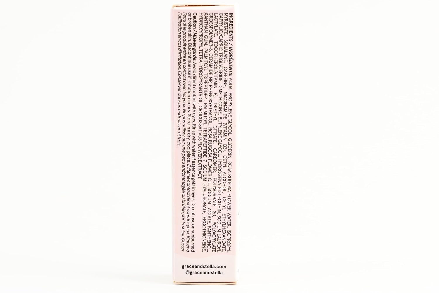 Woman wearing Grace & Stella Caffeine Under Eye Brightener Balm Stick-De-puff + brighten tired eyes with this caffeine-infused under eye balm stick. Hydrating, vegan, compact—your skincare essential on the go.