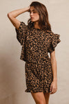 Woman wearing Leopard Print Waffle Texture Layered Ruffle Sleeve Top and Shorts Set-This leopard print set features a leopard print waffle texture top with layered ruffle sleeves, paired with matching shorts for a coordinated and stylish look. 