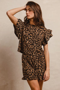 Woman wearing Leopard Print Waffle Texture Layered Ruffle Sleeve Top and Shorts Set-This leopard print set features a leopard print waffle texture top with layered ruffle sleeves, paired with matching shorts for a coordinated and stylish look. 
