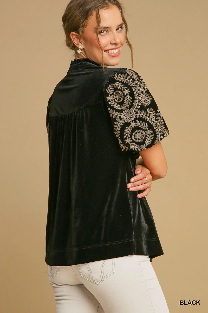 Woman wearing Velvet Embroidered Sleeve Blouse-This velvet embroidered sleeve blouse combines luxe velvet with embroidery for a sophisticated and stylish look. Perfect for adding a touch of glamour to your outfit.