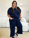 Textured, stretchy, and comfy. This two piece cropped pant with short sleeve top is a great travel set to stay comfortable in the car or plane. Available in a variety of colors and extended sizes.