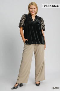 Woman wearing Velvet Embroidered Sleeve Blouse-This velvet embroidered sleeve blouse combines luxe velvet with embroidery for a sophisticated and stylish look. Perfect for adding a touch of glamour to your outfit.