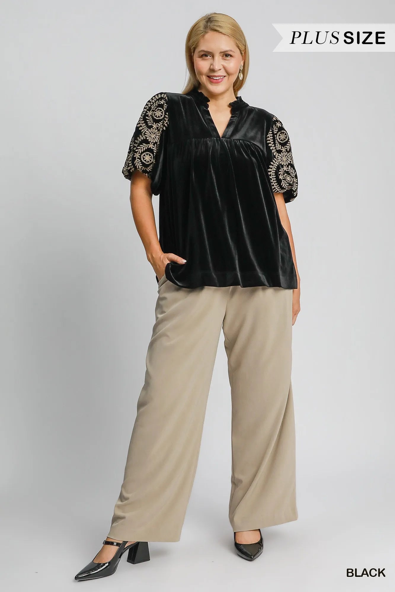 Woman wearing Velvet Embroidered Sleeve Blouse-This velvet embroidered sleeve blouse combines luxe velvet with embroidery for a sophisticated and stylish look. Perfect for adding a touch of glamour to your outfit.