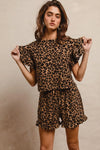 Woman wearing Leopard Print Waffle Texture Layered Ruffle Sleeve Top and Shorts Set-This leopard print set features a leopard print waffle texture top with layered ruffle sleeves, paired with matching shorts for a coordinated and stylish look. 