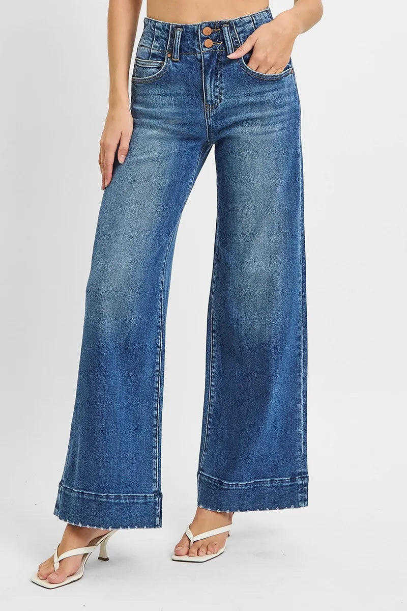 Woman wearing High Rise Wide Ankle Seam Detailed Jeans-Flattering high-rise ankle jeans with bold wide seams & raw hems. Available in standard & plus sizes. Slight stretch for comfort and everyday style.