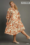 Woman wearing Floral Tiered Midi Shirt Dress-Flowy floral tiered midi shirt dress with 3/4 sleeves in rust + beige print. Boho-chic style in standard & plus sizes for casual or dressy days.