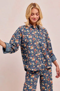 Shop Washed Floral Print Denim Shacket-This Washed Floral Print Denim Shacket features a relaxed oversized fit, button front, and vintage floral wash. Pair with wide leg jeans to complete the look.-Reef Love Boho-Chic Boutique