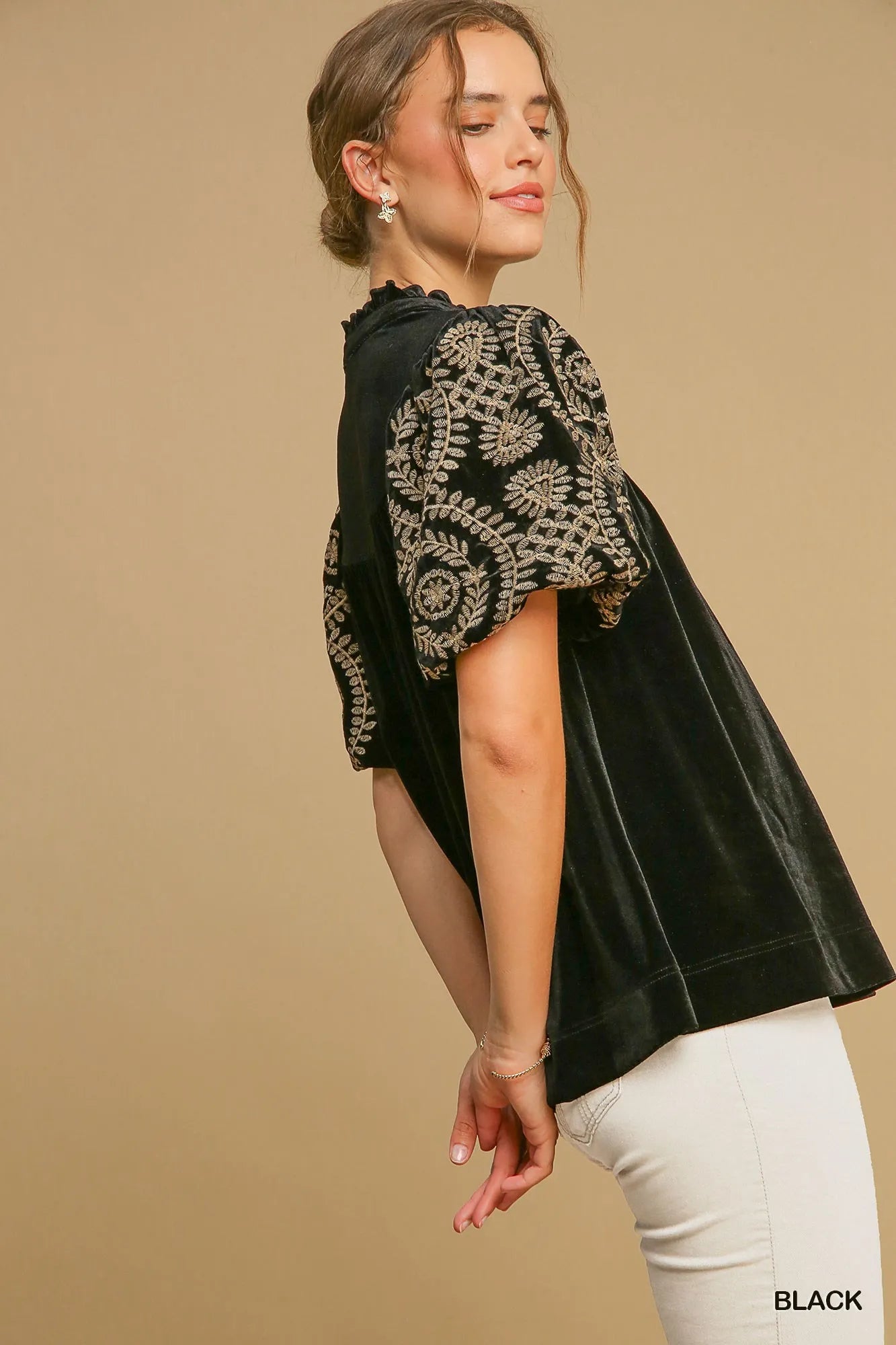 Woman wearing Velvet Embroidered Sleeve Blouse-This velvet embroidered sleeve blouse combines luxe velvet with embroidery for a sophisticated and stylish look. Perfect for adding a touch of glamour to your outfit.