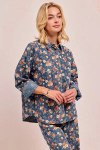 Shop Washed Floral Print Denim Shacket-This Washed Floral Print Denim Shacket features a relaxed oversized fit, button front, and vintage floral wash. Pair with wide leg jeans to complete the look.-Reef Love Boho-Chic Boutique