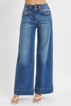 Woman wearing High Rise Wide Ankle Seam Detailed Jeans-Flattering high-rise ankle jeans with bold wide seams & raw hems. Available in standard & plus sizes. Slight stretch for comfort and everyday style.