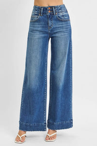 Woman wearing High Rise Wide Ankle Seam Detailed Jeans-Flattering high-rise ankle jeans with bold wide seams & raw hems. Available in standard & plus sizes. Slight stretch for comfort and everyday style.