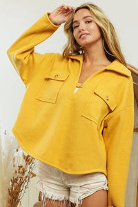 Woman wearing Honey Mustard Fleece Collared Sweatshirt-Fleece collared sweatshirt with flap pockets and button details. Cozy, stylish, and perfect for layering all season long, your new cozy fall favorite.