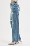 Woman wearing Relaxed Fit Wide Baggy Leg Washed Jeans-Mid-rise relaxed fit, wide baggy leg jeans feature a tie-washed design, slightly distressed for a cool and edgy aesthetic - for creating a casual trendy outfit.